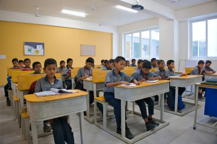 A group of children sitting at desks in a classroom